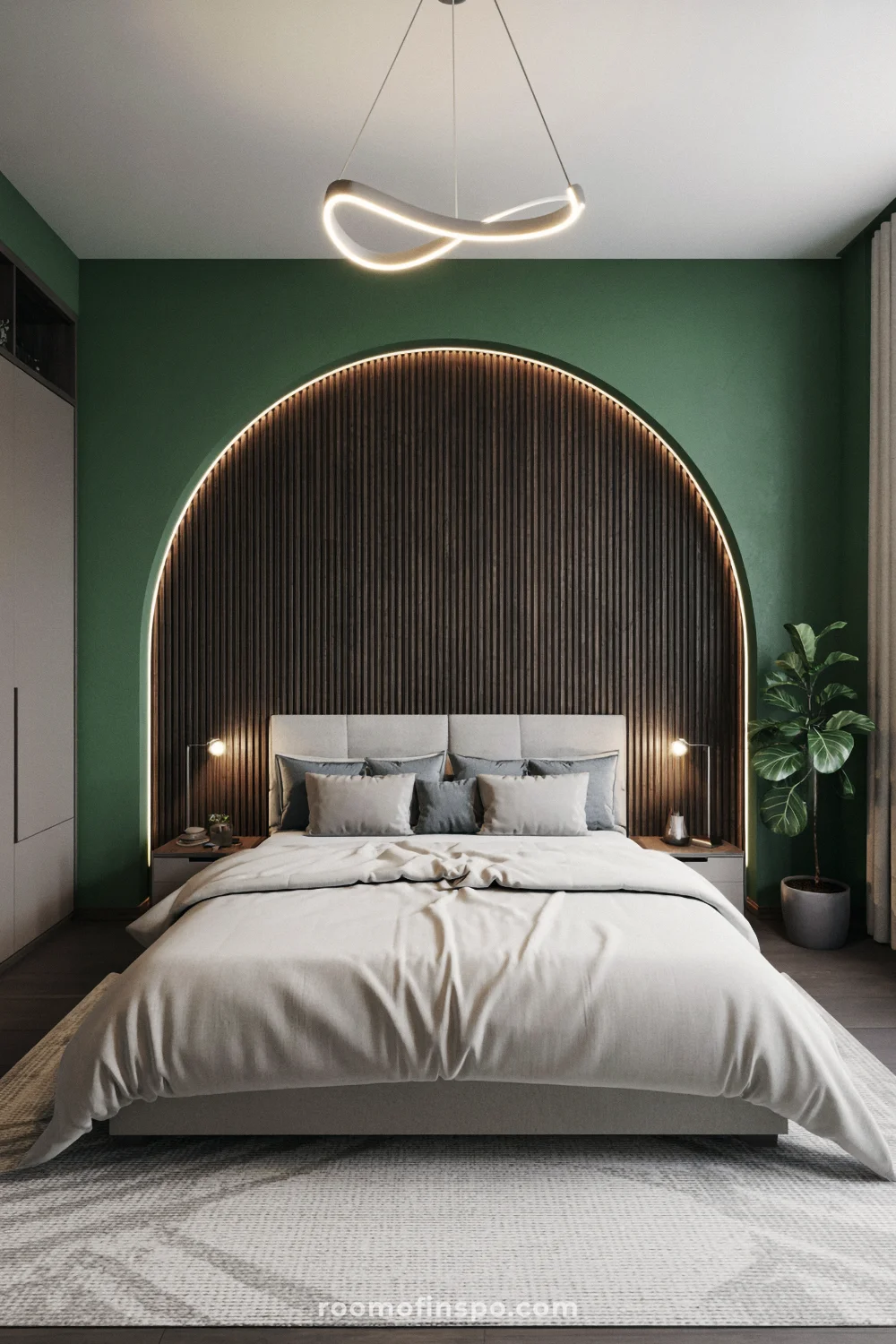 Luxurious bedroom with deep green accent wall, arched wood headboard, and dark wood slats.