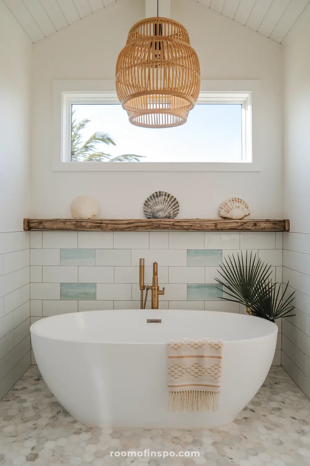A bohemian coastal bathroom with sea glass-colored tiles, a freestanding tub, and driftwood accents for a serene, beach-inspired retreat.