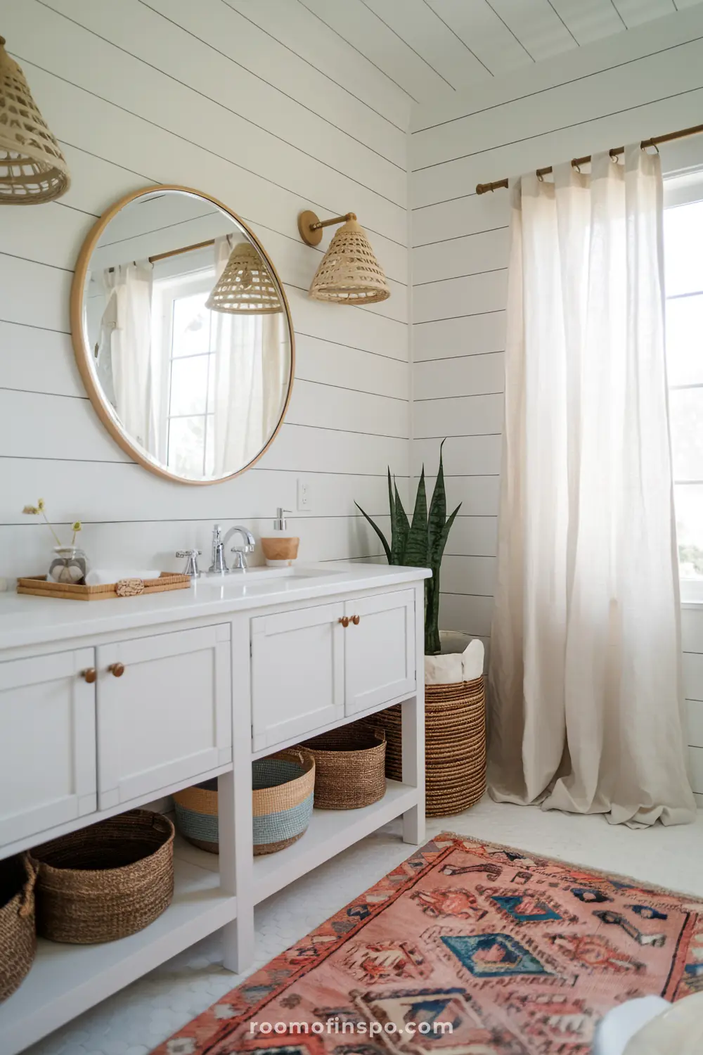 A bohemian coastal bathroom with white shiplap walls, light wood accents, and woven baskets for a breezy, relaxed feel.