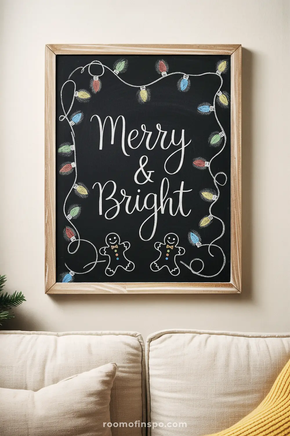 "Merry & Bright" is written on a framed chalkboard, bordered by colorful chalk Christmas lights and two cheerful gingerbread men.