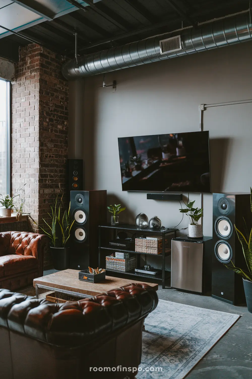 A stylish industrial man cave with loft-inspired decor and a mini fridge.