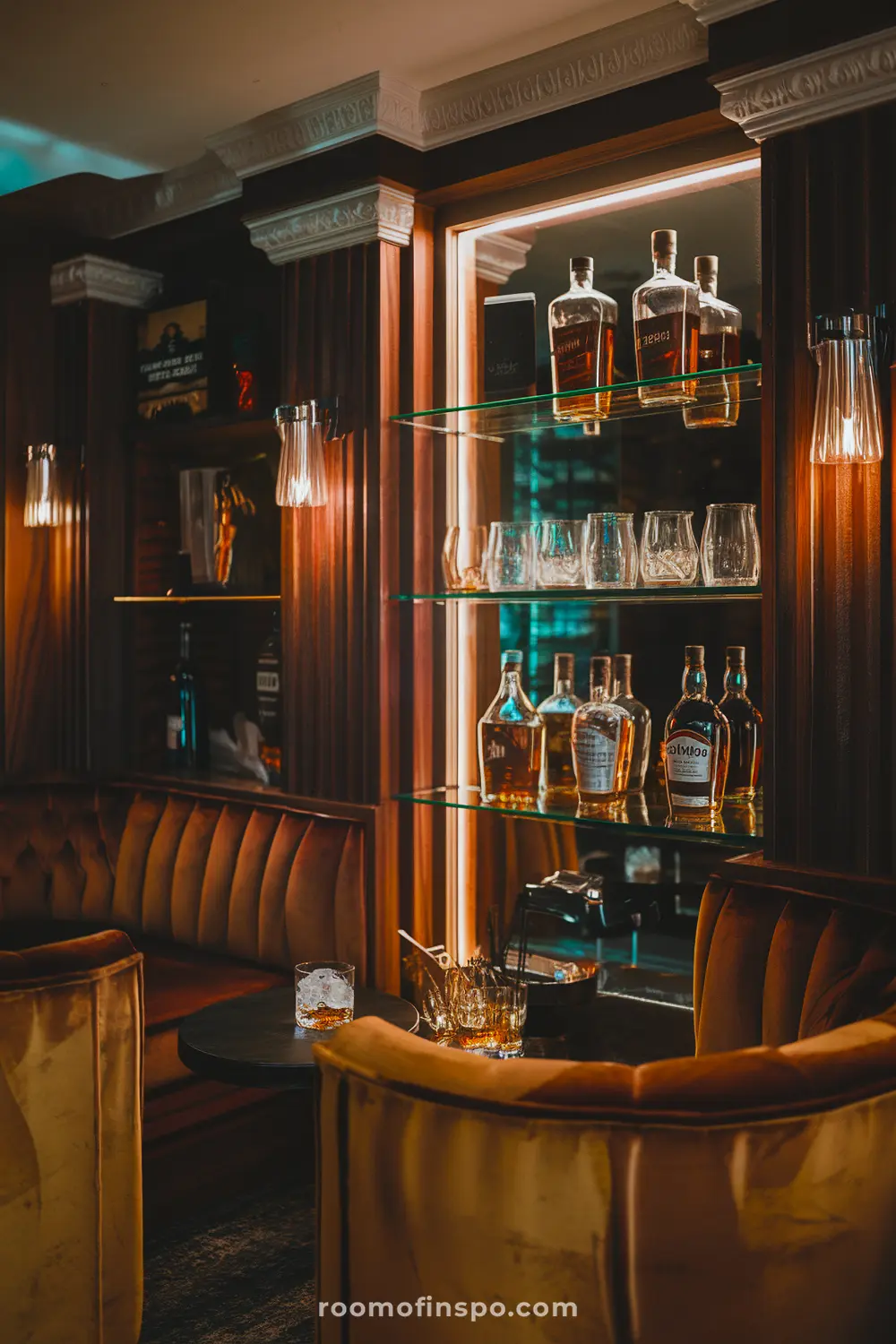 A sophisticated whiskey man cave with luxurious wood and a stocked bar.