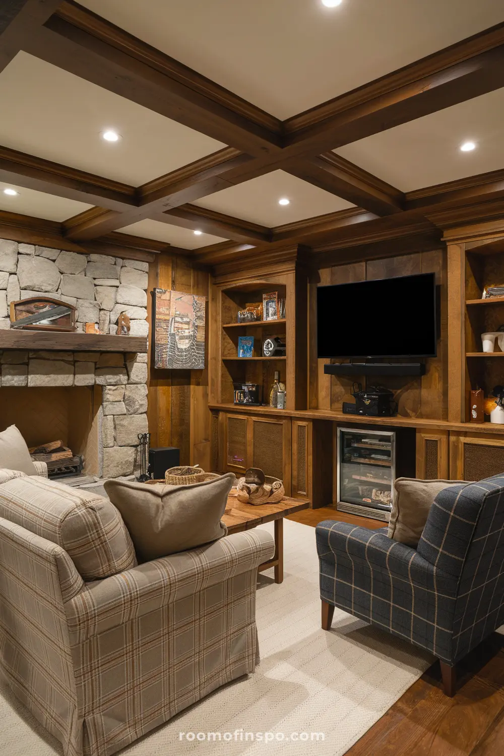 A cozy rustic cabin-themed man cave with wood, plaid accents, and a TV.