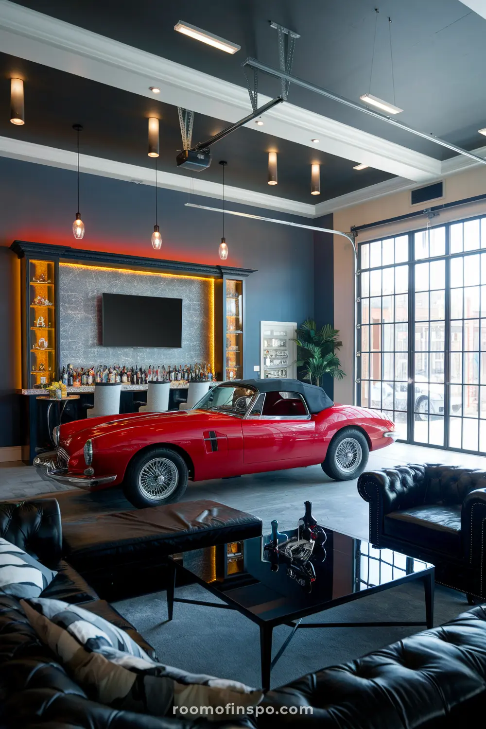 A classy automobile-themed garage man cave with a car display and a mini bar.
