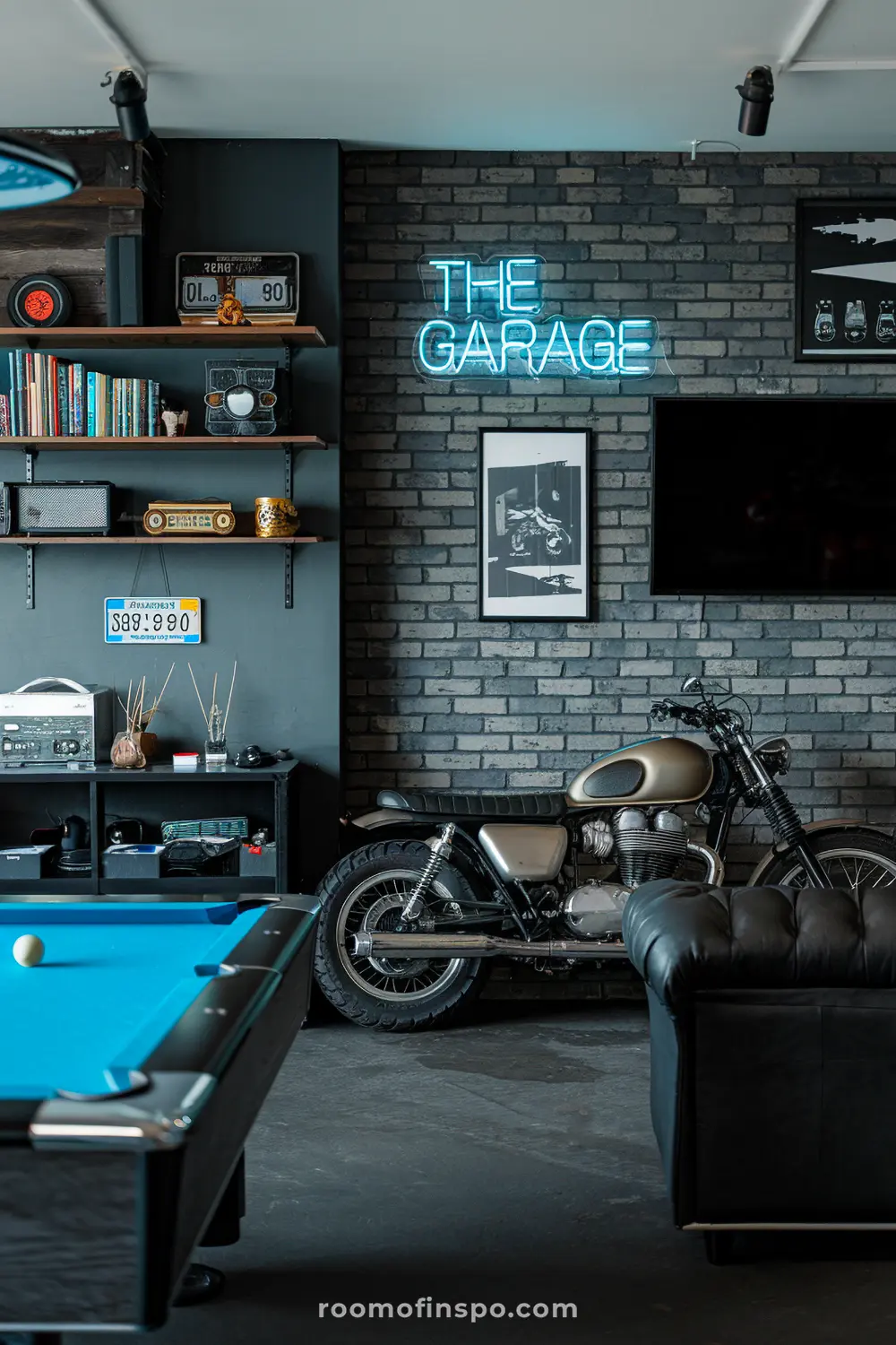 A classy automobile-themed garage man cave with a bike display and a mini fridge.