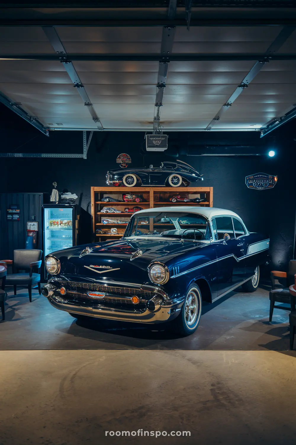 A classy automobile-themed garage man cave with a car display and a fridge.