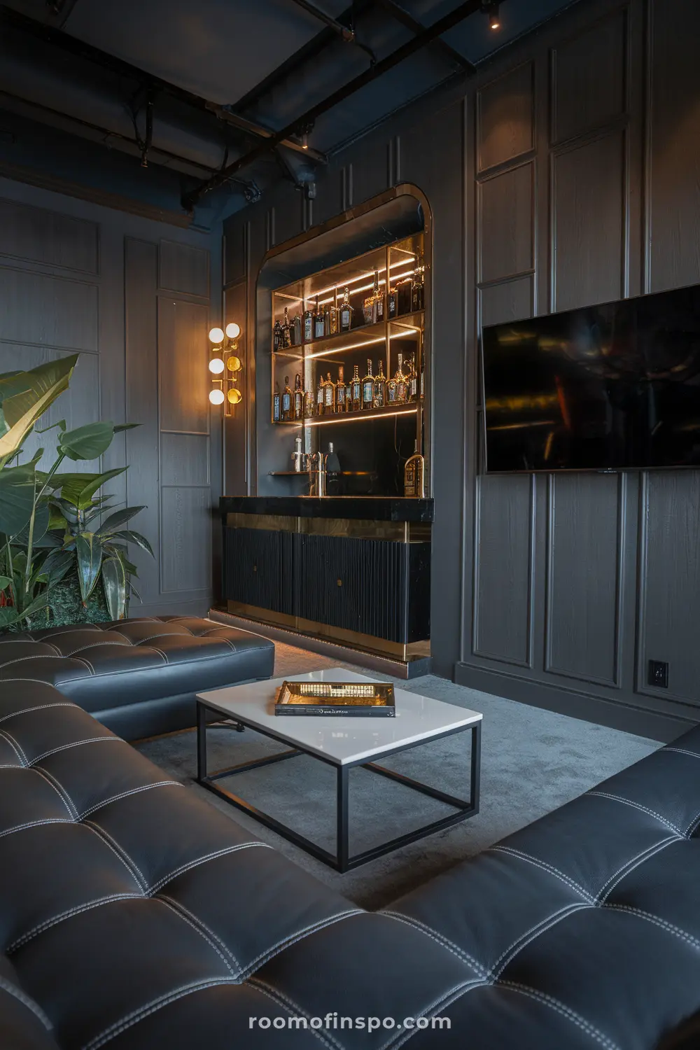 A luxurios, moody man cave with sleek gadgets, a bar, and a TV.