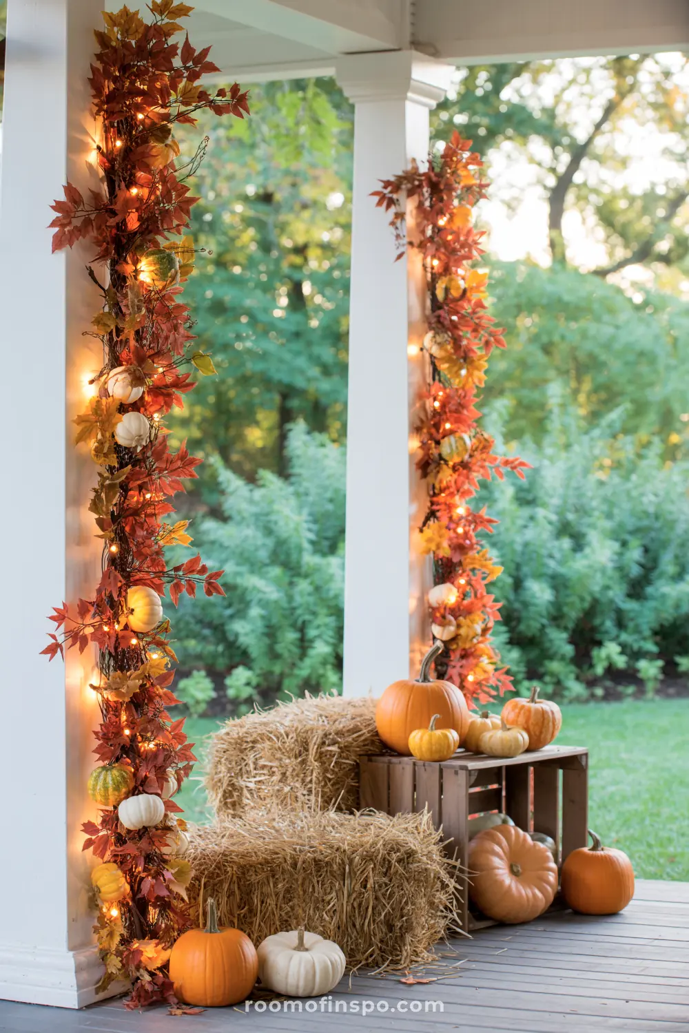 Illuminate garlands with pumpkins adorn a fall front porch, creating a warm and festive autumn ambiance.
