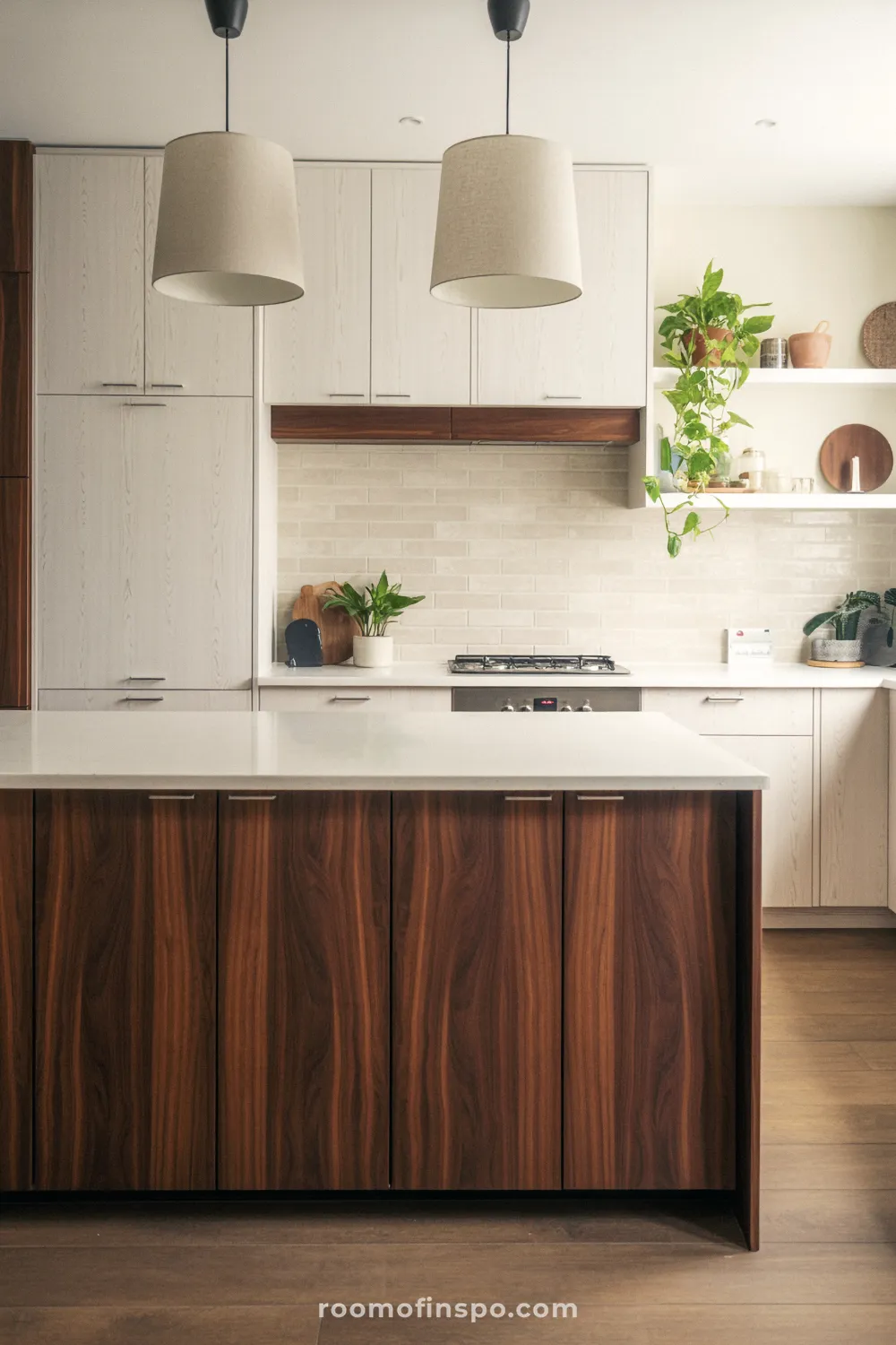 A modern kitchen design emphasizing rich, dark wood cabinetry, integrated appliances, and a sleek, light countertop.