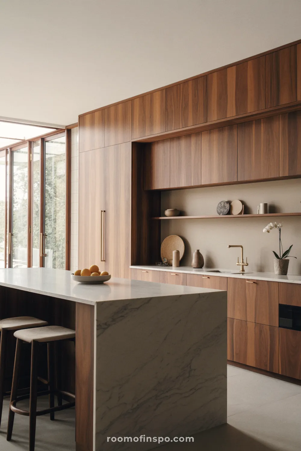 This elegant kitchen highlights natural wood cabinetry with an integrated stove and hood, paired with light, modern fixtures.