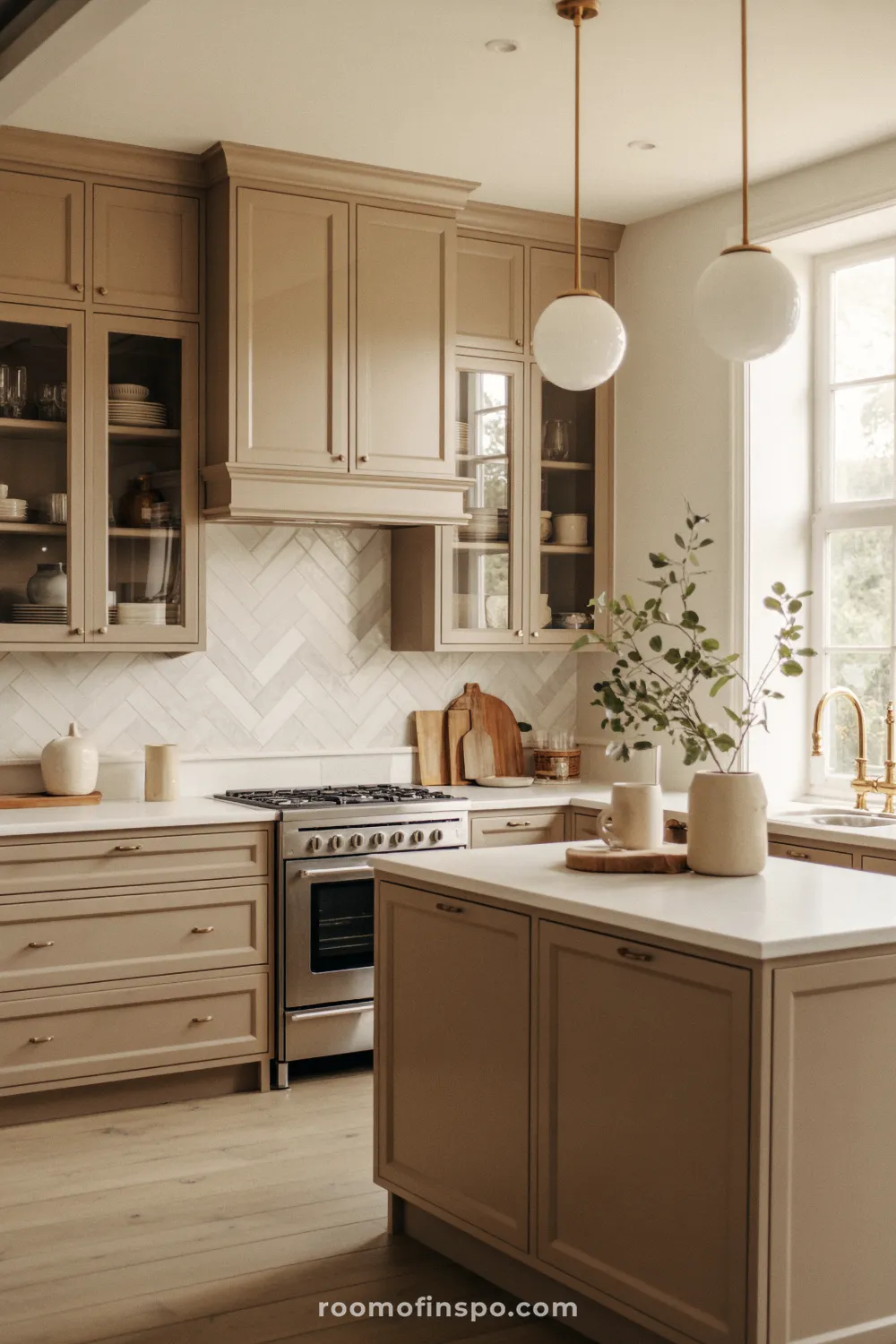 A trendy kitchen featuring soft, matte textures in light neutrals, offering a calm and refined cooking and gathering space.