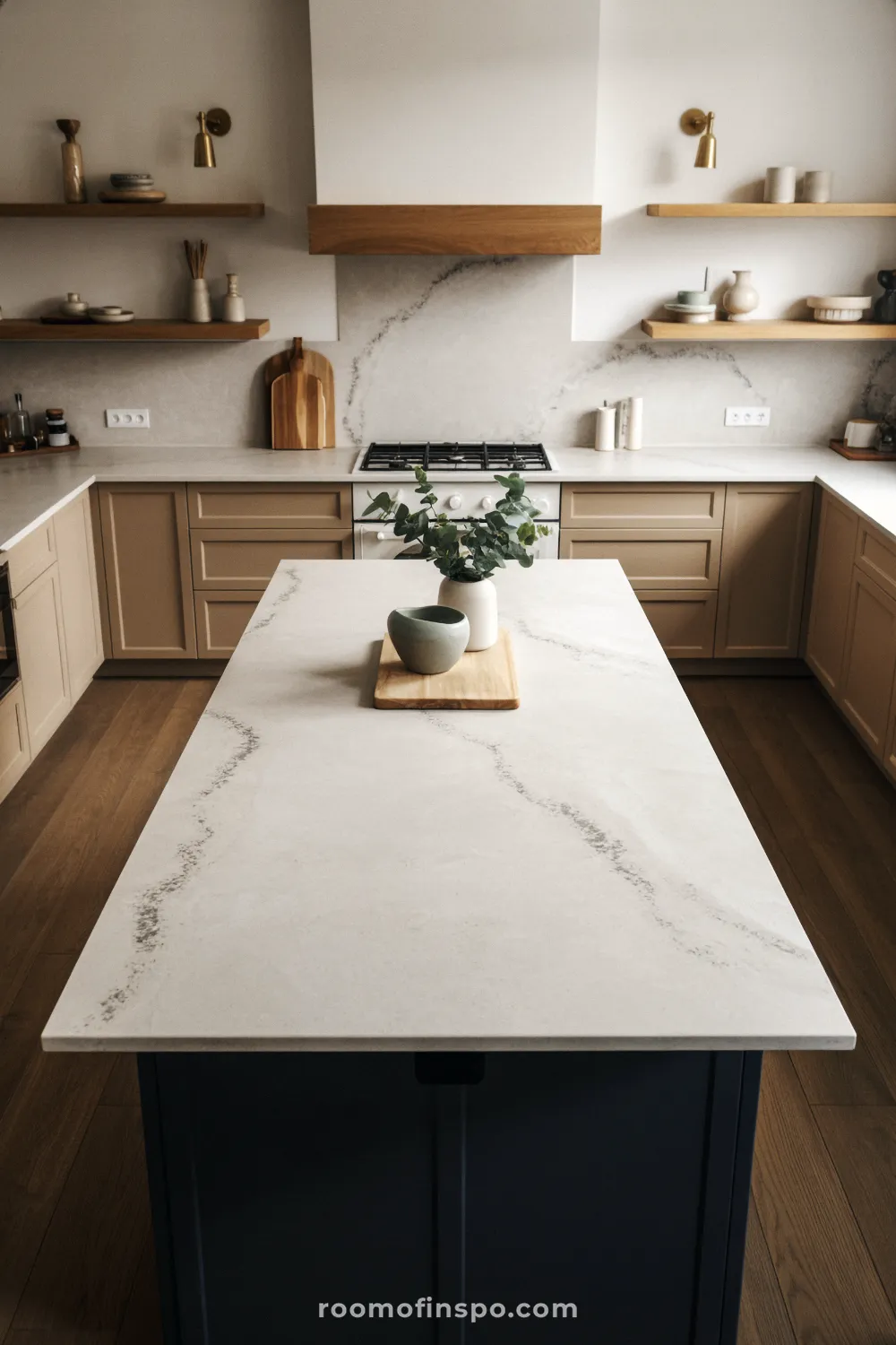 A small, bright kitchen with expansive white quartz countertops, providing ample, clean space for food preparation.