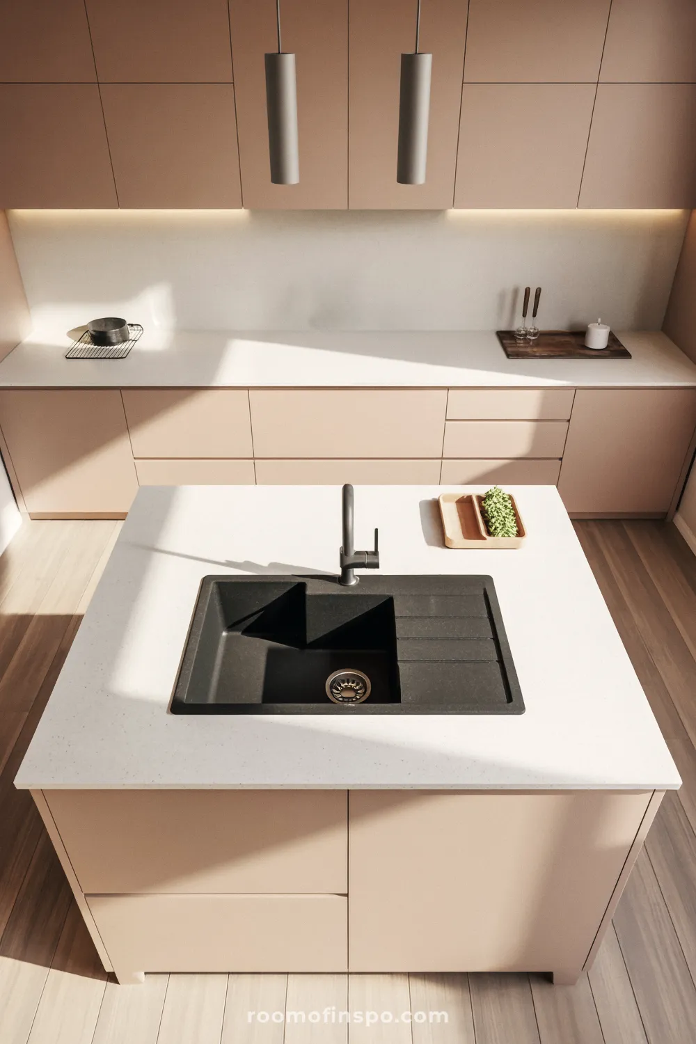 A monochromatic kitchen with dark cabinetry and countertops, featuring a high-end gas cooktop and integrated stainless steel appliances.