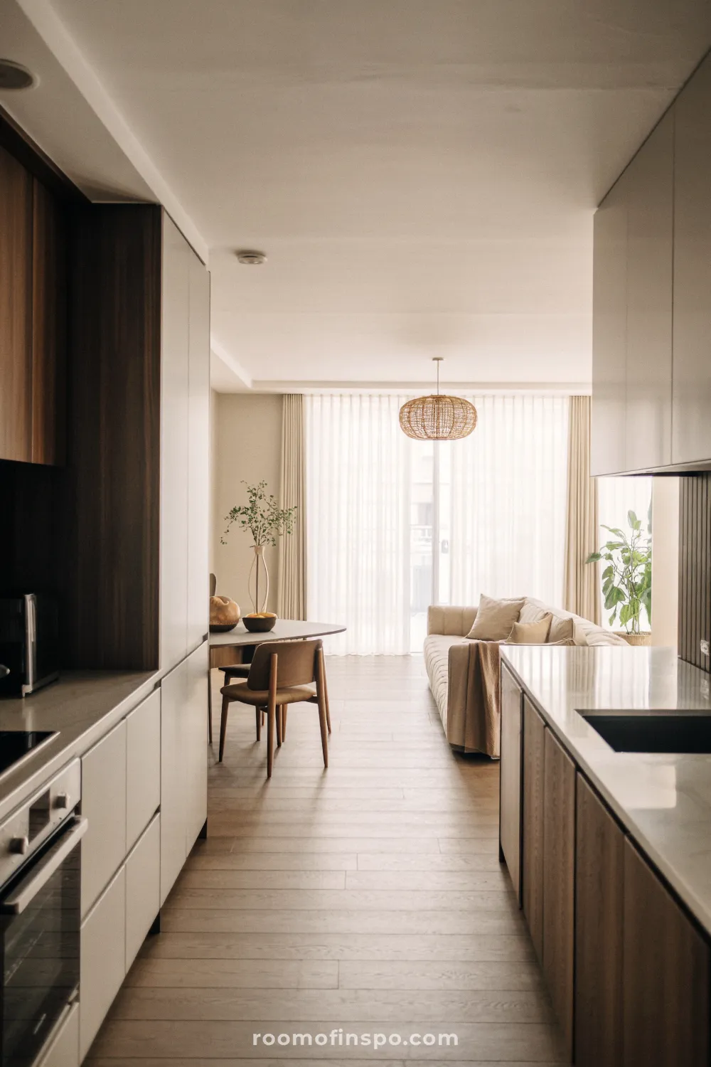 A bright, unique kitchen featuring a large central island, light wood tones, and an eclectic mix of modern and traditional elements.