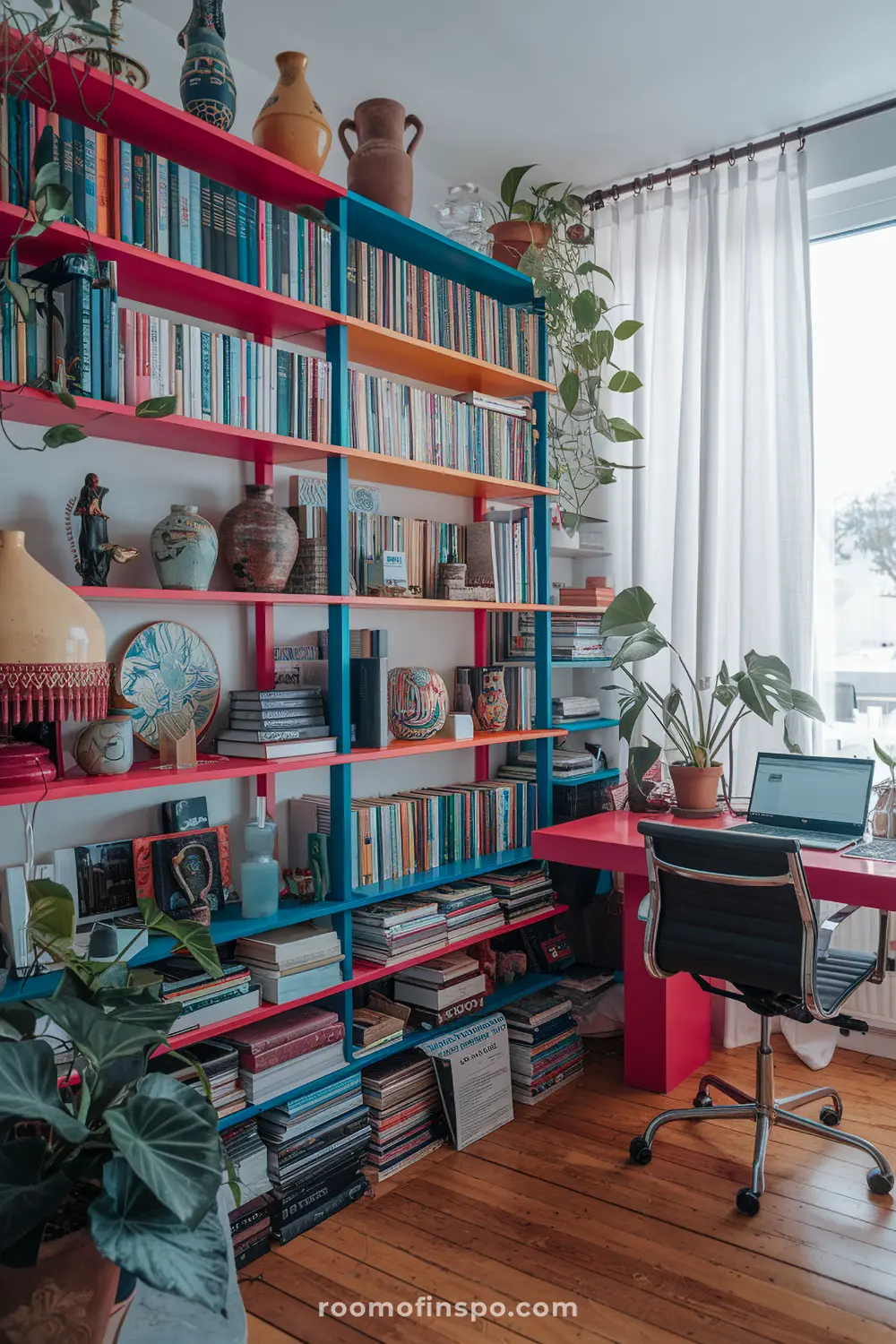 A home office with maximalist shelving and laptop.