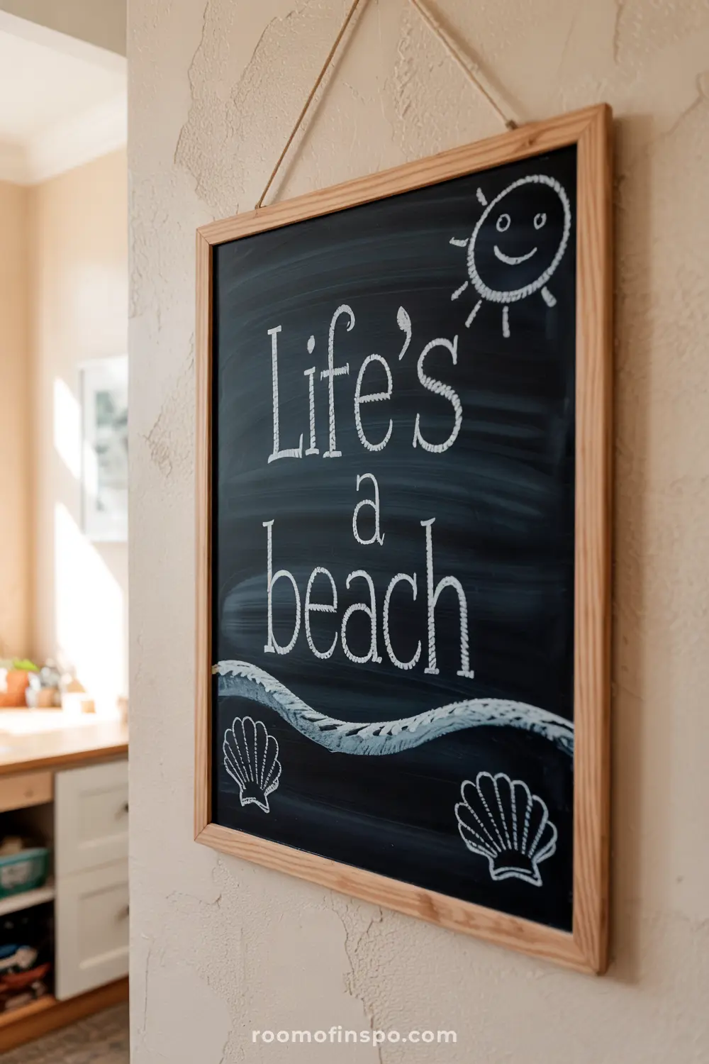 Indoor chalkboard with "Life’s a beach" and seashell doodles.