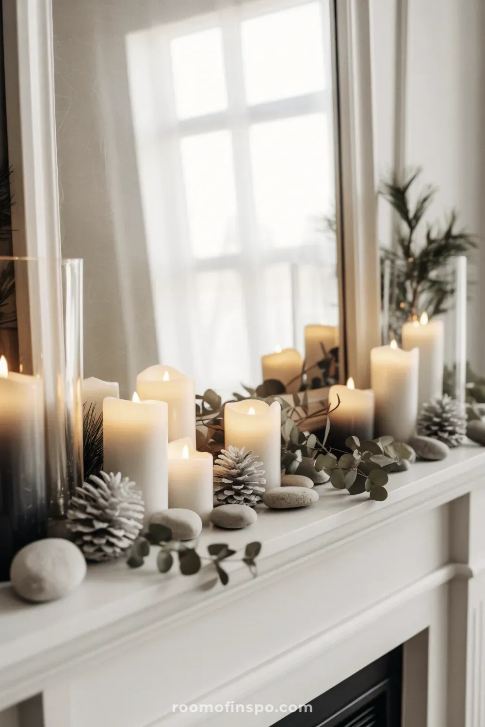 A bright winter mantel display with numerous gleaming white candles creating a warm, cozy glow on the fireplace.